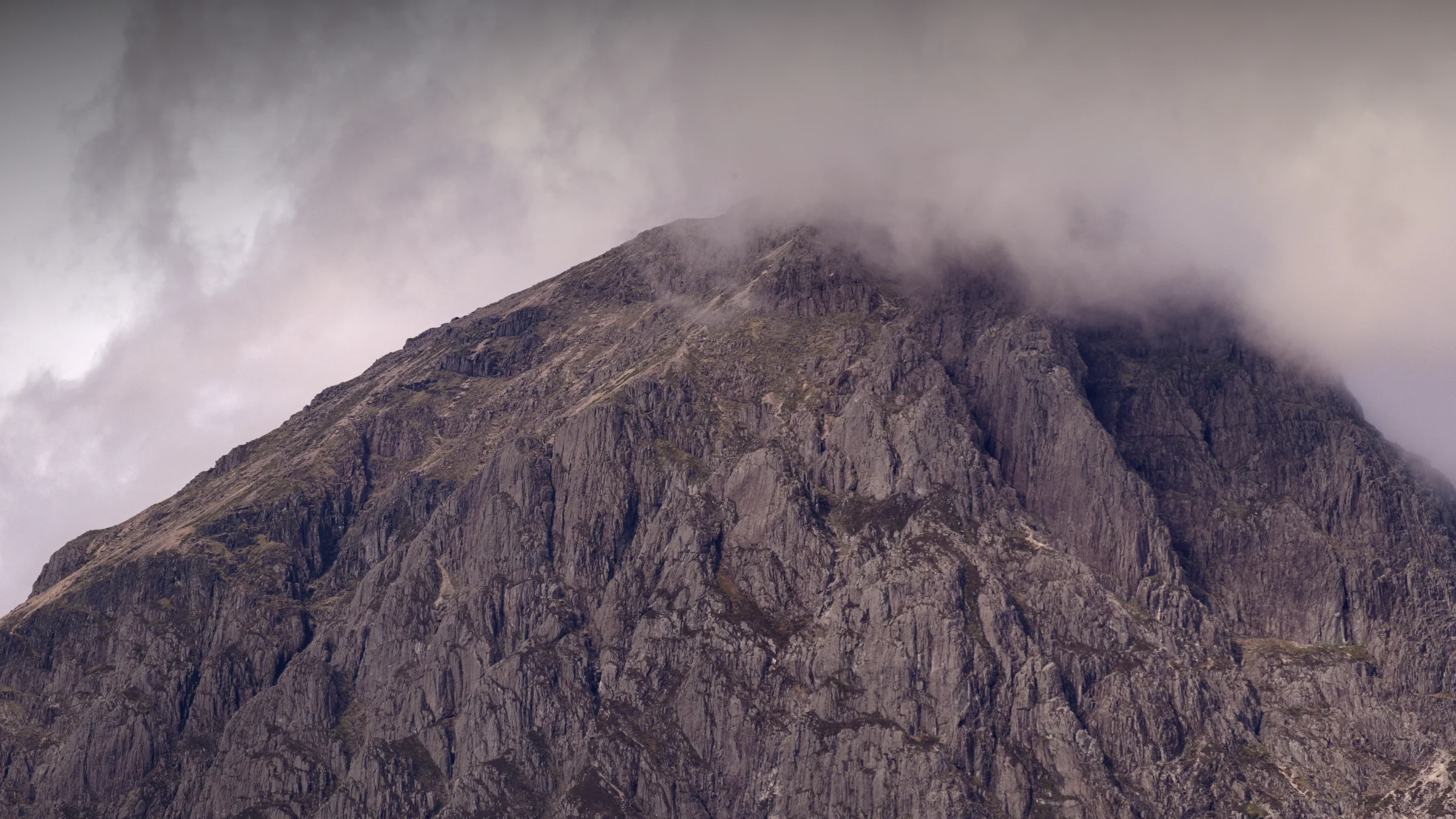 There's a strong chance this image contains the following subjects: landscape,  travel,  nature,  scotland,  highlands,  scottishhighlands,  buachailleetivemor,  glencoe,  cloud. The photographer has provided the following description: Taken in Glencoe, April 2025. Buachaille Etive Mor, in the clouds. Photographer_name: Chris Michael. Title: The Mountain in the Sky. The photographer has provided the following description: Taken in Glencoe, April 2025. Buachaille Etive Mor, in the clouds. Make: fujifilm. Model: X-T5. Technical: 55-200mm. Published: 2025-09-08 21:34:46