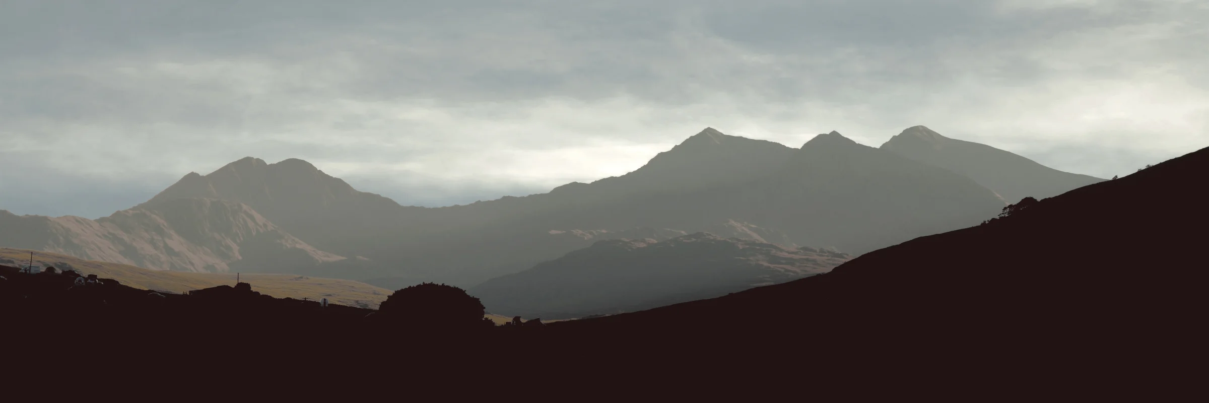 There's a strong chance this image contains the following subjects: sky,  landscape,  travel,  nature,  wales,  snowdonia,  eryri,  eryrinationalpark,  nationalpark,  snowdon. The photographer has provided the following description: Here is the Snowdon mountain range in Wales, taken as a series of (12) shots and stitched in Affinity Photo. Photographer_name: Chris Michael. Title: Panoramic Snowdonia . The photographer has provided the following description: Here is the Snowdon mountain range in Wales, taken as a series of (12) shots and stitched in Affinity Photo. Make: fujifilm. Model: X-T5. Technical: 16-80mm. Published: 2025-09-09 15:58:14