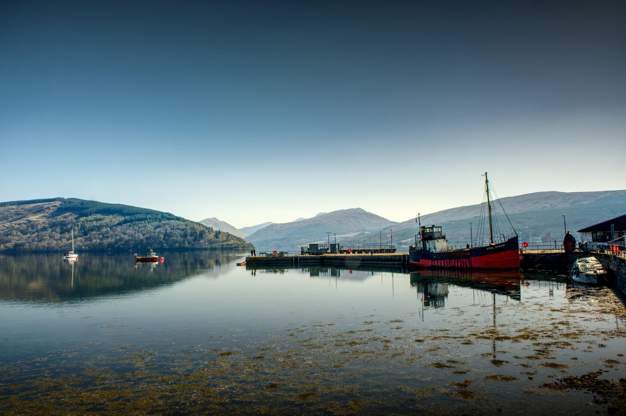 There's a strong chance this image contains the following subjects: water,  lake,  travel,  sea,  sunset,  dawn,  reflection,  scotland,  highlands,  scottishhighlands,  inveraray. The photographer has provided the following description: In the Scottish Highlands is Inveraray. There's no need for any more words other than.......ahhh....peace! Photographer_name: Chris Michael. Title: Inveraray. The photographer has provided the following description: In the Scottish Highlands is Inveraray. There's no need for any more words other than.......ahhh....peace! Make: fujifilm. Model: X-T5. Technical: 16-80mm. Published: 2025-09-08 21:44:49
