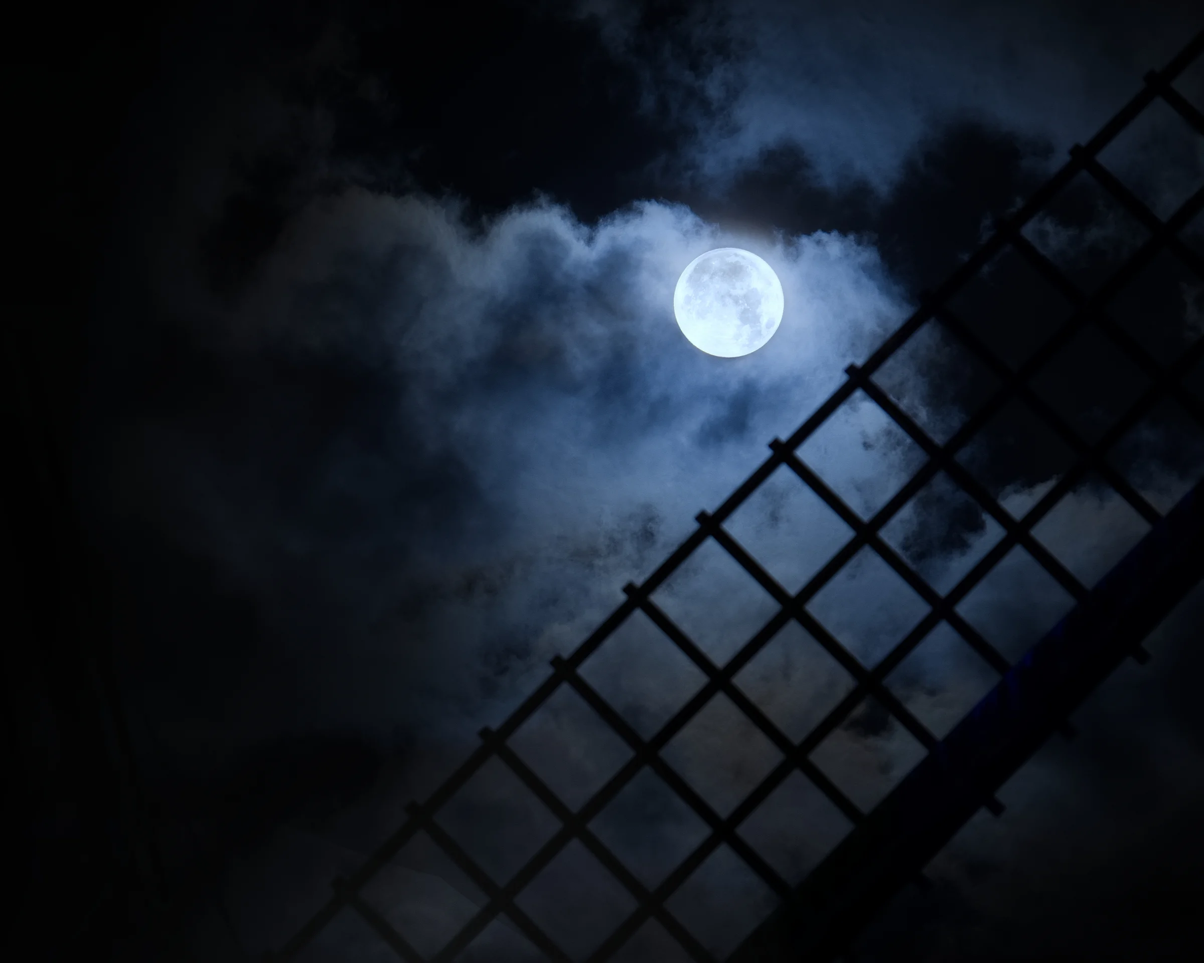 There's a strong chance this image contains the following subjects: fog,  dark,  lancashire,  smoke,  moon,  lytham,  windmill,  lythamstannes. The photographer has provided the following description: This was the Blue Moon seen over Lytham Windmill in Lancashire in August 2023. This photo was used on ITV Granada Weather. Photographer_name: Chris Michael. Title: Blue Moon. The photographer has provided the following description: This was the Blue Moon seen over Lytham Windmill in Lancashire in August 2023. This photo was used on ITV Granada Weather. Make: canon. Model: EOS R. Technical: RF70-200mm at 200mm.. Published: 2025-09-06 19:02:34