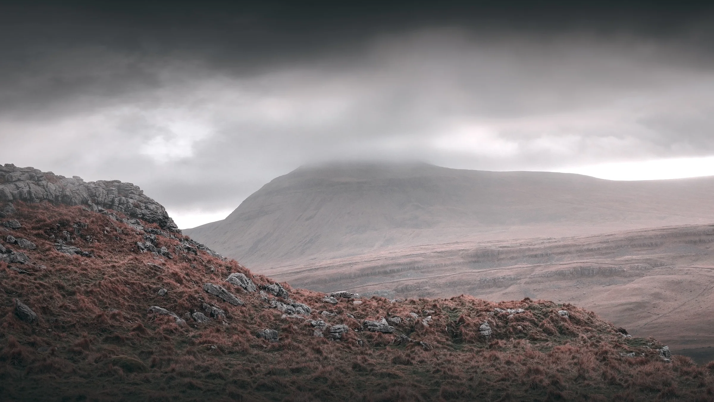 There's a strong chance this image contains the following subjects: sky,  fog,  landscape,  travel,  nature,  yorkshire,  yorkshiredales,  cloud. The photographer has provided the following description: From Twisleton Scar End.. this is gorgeous Ingleborough mountain in the morning fog and low cloud. Photographer_name: Chris Michael. Title: Ingleborough Morning. The photographer has provided the following description: From Twisleton Scar End.. this is gorgeous Ingleborough mountain in the morning fog and low cloud. Make: canon. Model: EOS R. Technical: 16MM. Published: 2025-09-07 23:17:00