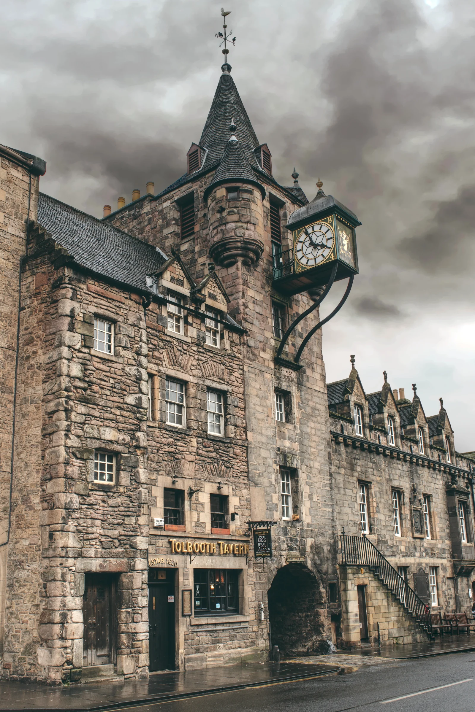There's a strong chance this image contains the following subjects: architecture,  street,  travel,  city,  building,  scotland,  castle,  edinburgh,  pub. The photographer has provided the following description: The Tolbooth Tavern can be found on the Royal Mile in Edinburgh, Scotland. Photographer_name: Chris Michael. Title: Tolbooth Tavern. The photographer has provided the following description: The Tolbooth Tavern can be found on the Royal Mile in Edinburgh, Scotland. Make: fujifilm. Model: X-T5. Technical: 16-80mm. Published: 2025-09-08 16:58:36