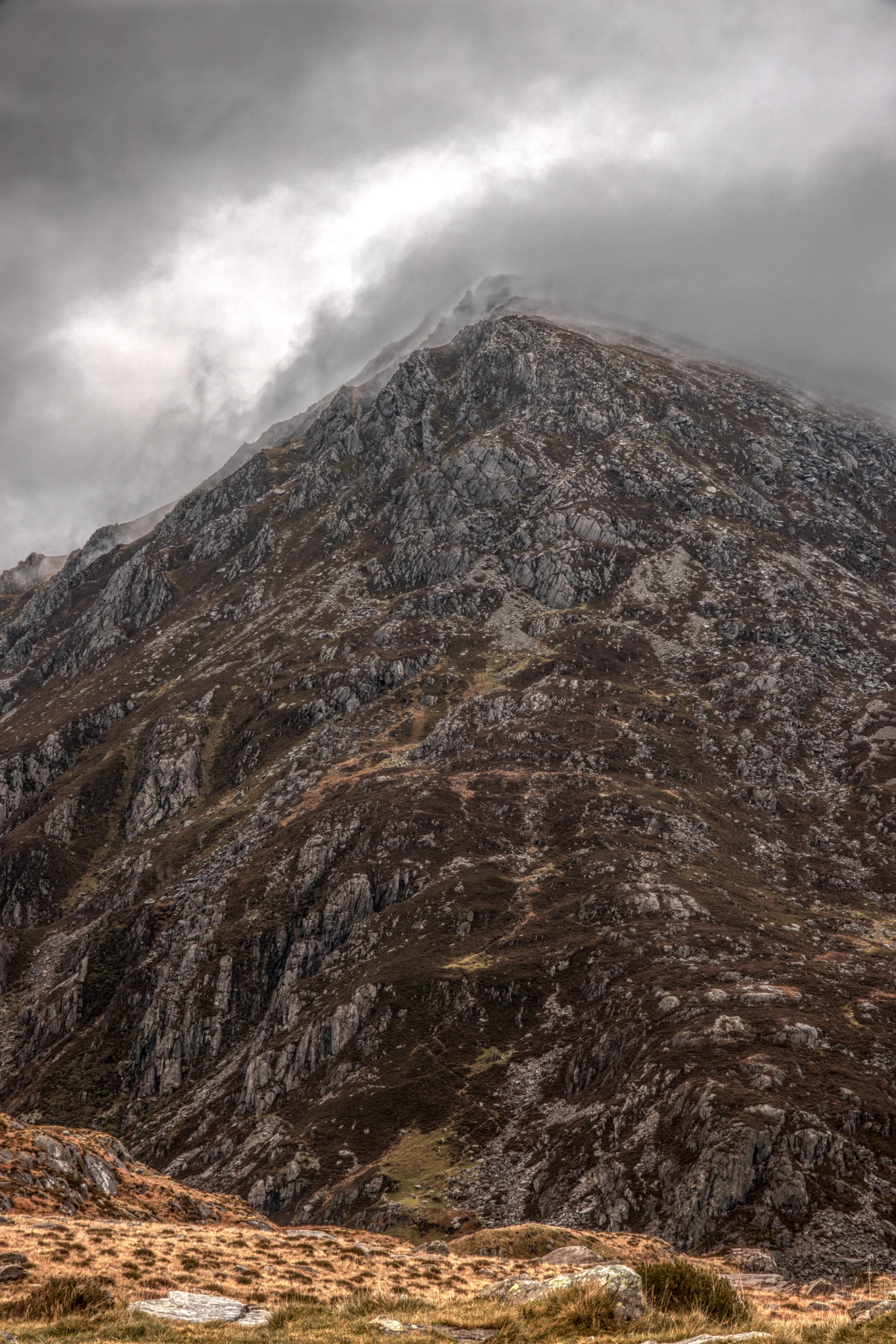 There's a strong chance this image contains the following subjects: sky,  landscape,  travel,  wales,  snowdonia,  eryri,  eryrinationalpark,  snowdon,  penyrolewen. The photographer has provided the following description: This is the gorgeous mountain 'Pen Yr Ole Wen' as seen from Cwm Idwal, Wales. Photographer_name: Chris Michael. Title: Pen Yr Ole Wen. The photographer has provided the following description: This is the gorgeous mountain 'Pen Yr Ole Wen' as seen from Cwm Idwal, Wales. Make: fujifilm. Model: X-T5. Technical: 55-200mm. Published: 2025-09-09 16:10:51