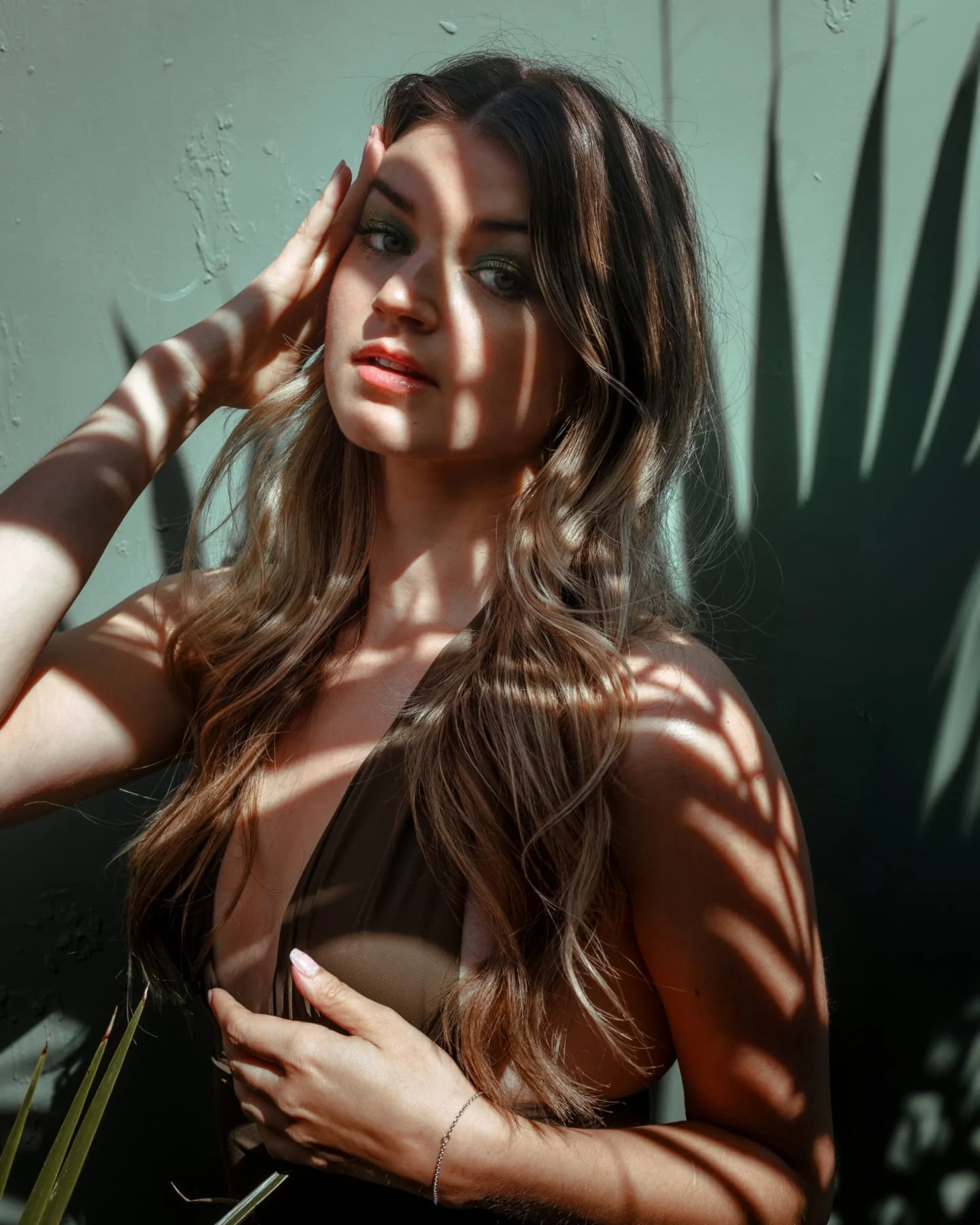 There's a strong chance this image contains the following subjects: portrait. Source: https://www.instagram.com/anna.derr.photo/ Photographer_name: Anna Derr. Title: Palm Noir. Published: 2025-10-12 15:23:57