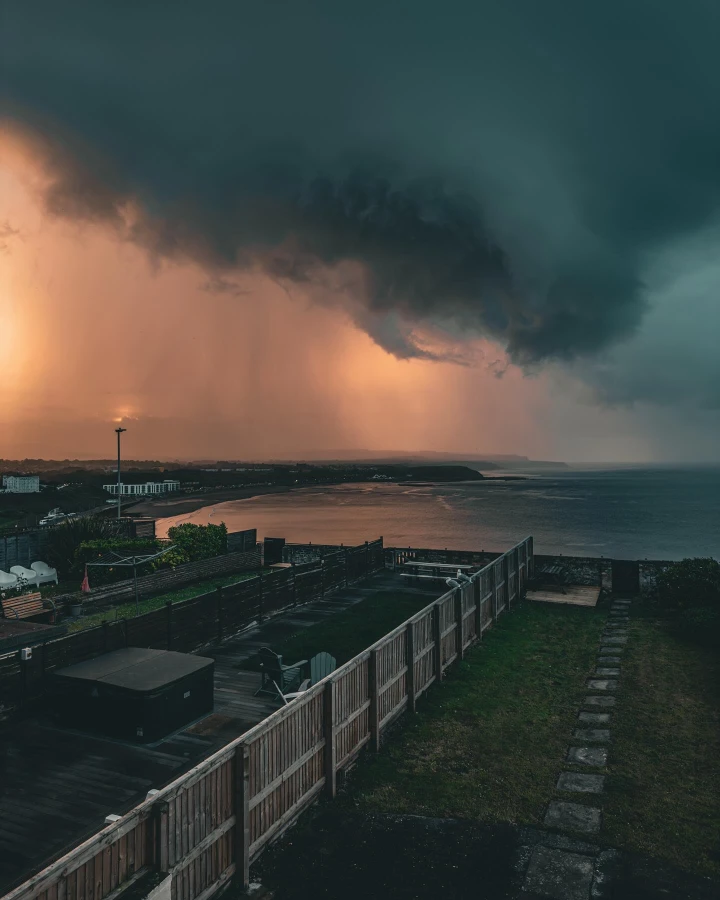 There's a strong chance this image contains the following subjects: sky,  water,  sea. FOTO has this to say about the photograph: Moody and dramatic with engaging leading lines, this photograph has it all. Source: https://www.instagram.com/ascotography/ Photographer_name: Alec Scott. Title: Over Scarborough North Bay. FOTO has this to say about the photograph: Moody and dramatic with engaging leading lines, this photograph has it all. Published: 2025-06-13 16:58:15