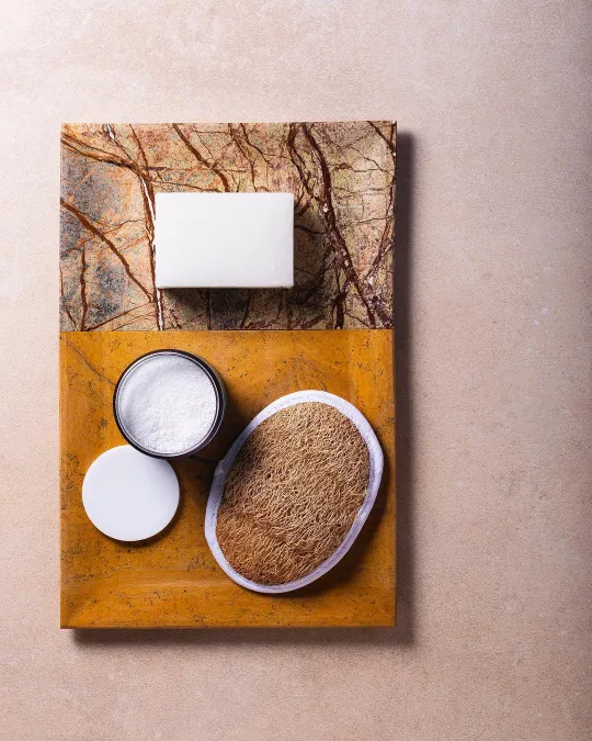 There's a strong chance this image contains the following subjects: still life,  product,  negative space. Source: https://www.instagram.com/rosophotography/ Photographer_name: RoSo Creative Studio. Title: Bath products - Soap, Bath Salt and Loofah. Published: 2025-06-27 14:49:24