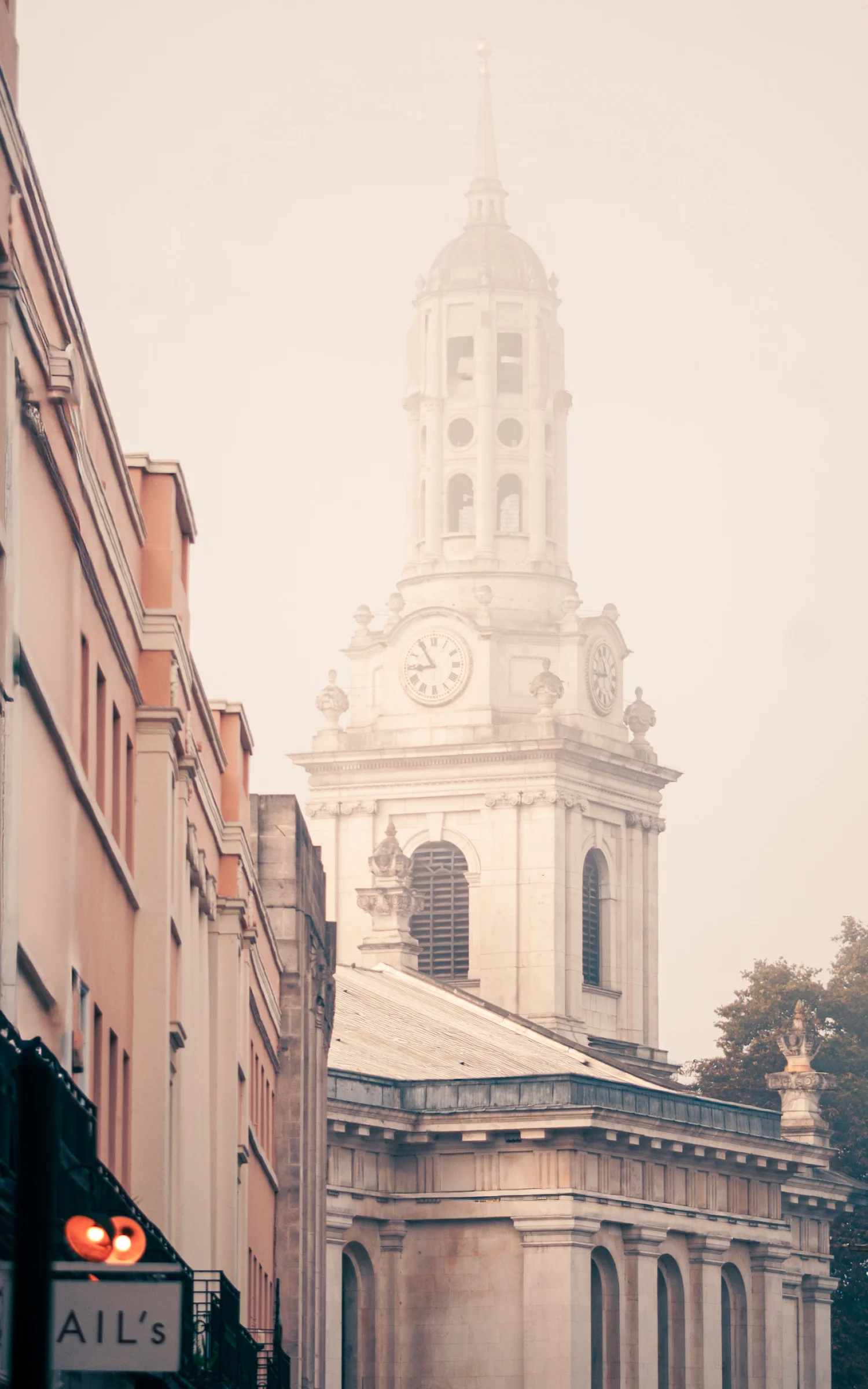 There's a strong chance this image contains the following subjects: architecture,  travel,  city,  london,  church. The photographer has provided the following description: Taken on a foggy morning in Greenwich, the spire of St Alfege Church creeping into the fog. Photographer_name: Lee Sillery. Title: St Alfege Church. The photographer has provided the following description: Taken on a foggy morning in Greenwich, the spire of St Alfege Church creeping into the fog. Make: sony. Model: a300. Technical: 100mm (100-200mm), f4.5, 1/160 SEC @ ISO 100. Published: 2025-09-29 10:46:51
