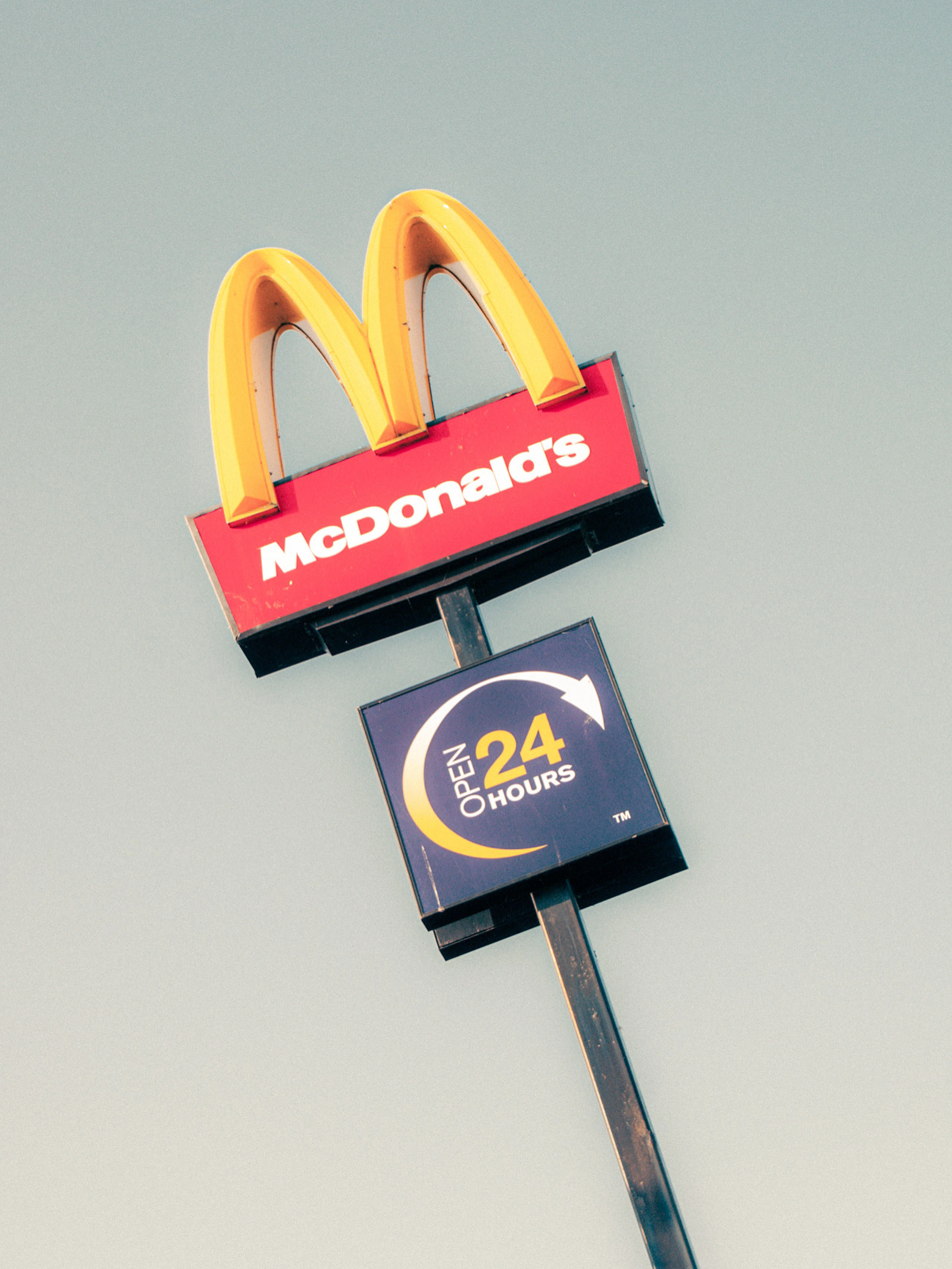 There's a strong chance this image contains the following subjects: negative space. The photographer has provided the following description: The classic golden arches of McDonalds Photographer_name: Lee Sillery. Title: No Time To Stop. The photographer has provided the following description: The classic golden arches of McDonalds Make: sony. Model: a300. Technical: 18-70mm. 1/80 f5.6 ISO 400. Published: 2025-08-17 21:15:44